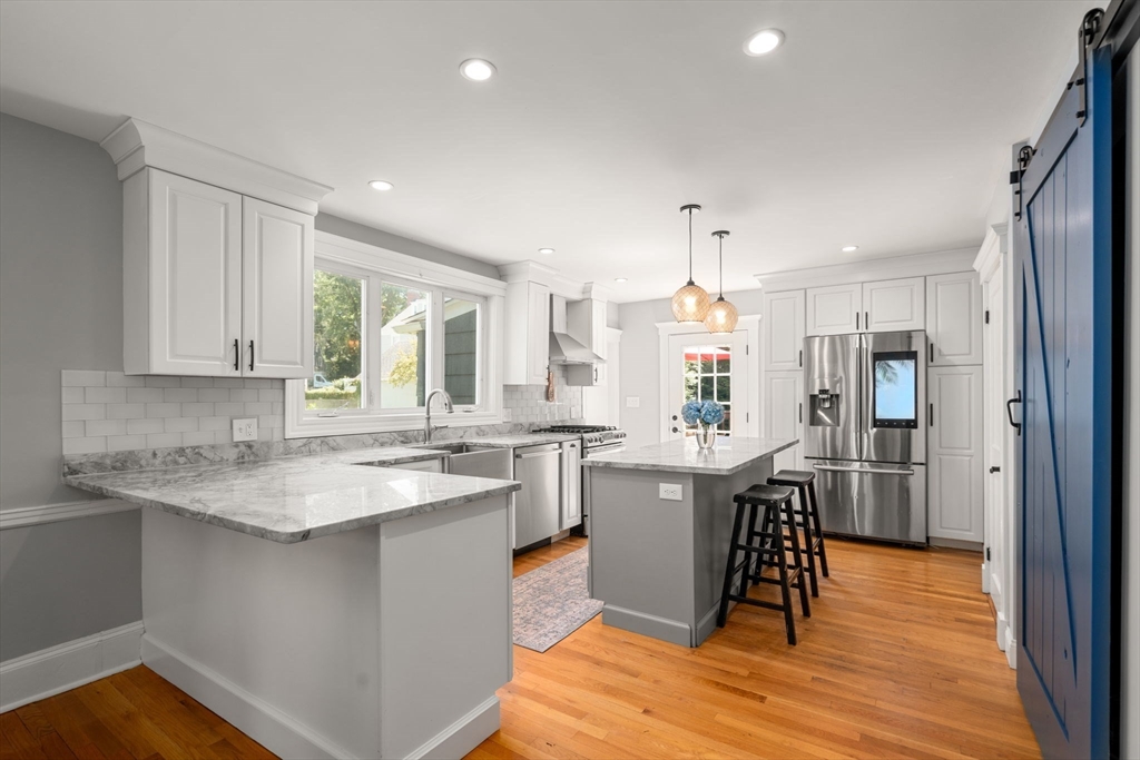 27 Frothingham Street Milton, MA 02186 - Photo 10 of 32 a kitchen with sink cabinets and refrigerator