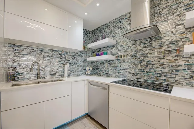 a kitchen with a sink and cabinets