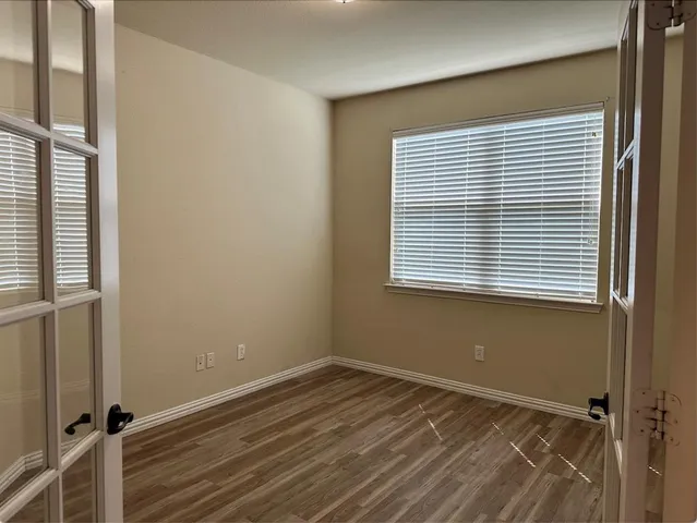 a view of a room that has a window in it