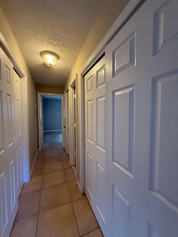 a hallway with closet area