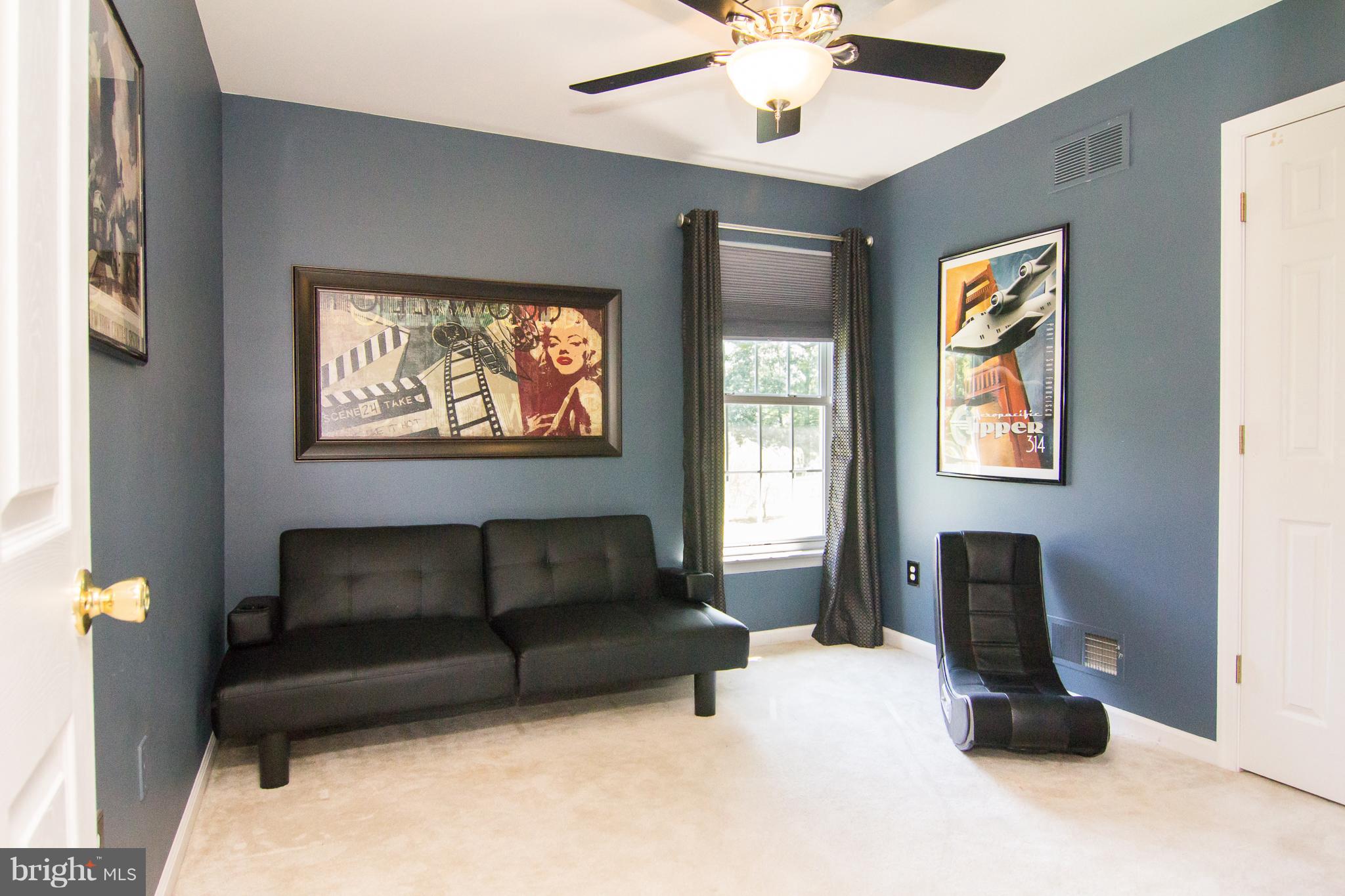 107 Trevanion Road Taneytown, MD 21787 - Photo 22 of 30 a living room with furniture ceiling fan and a window