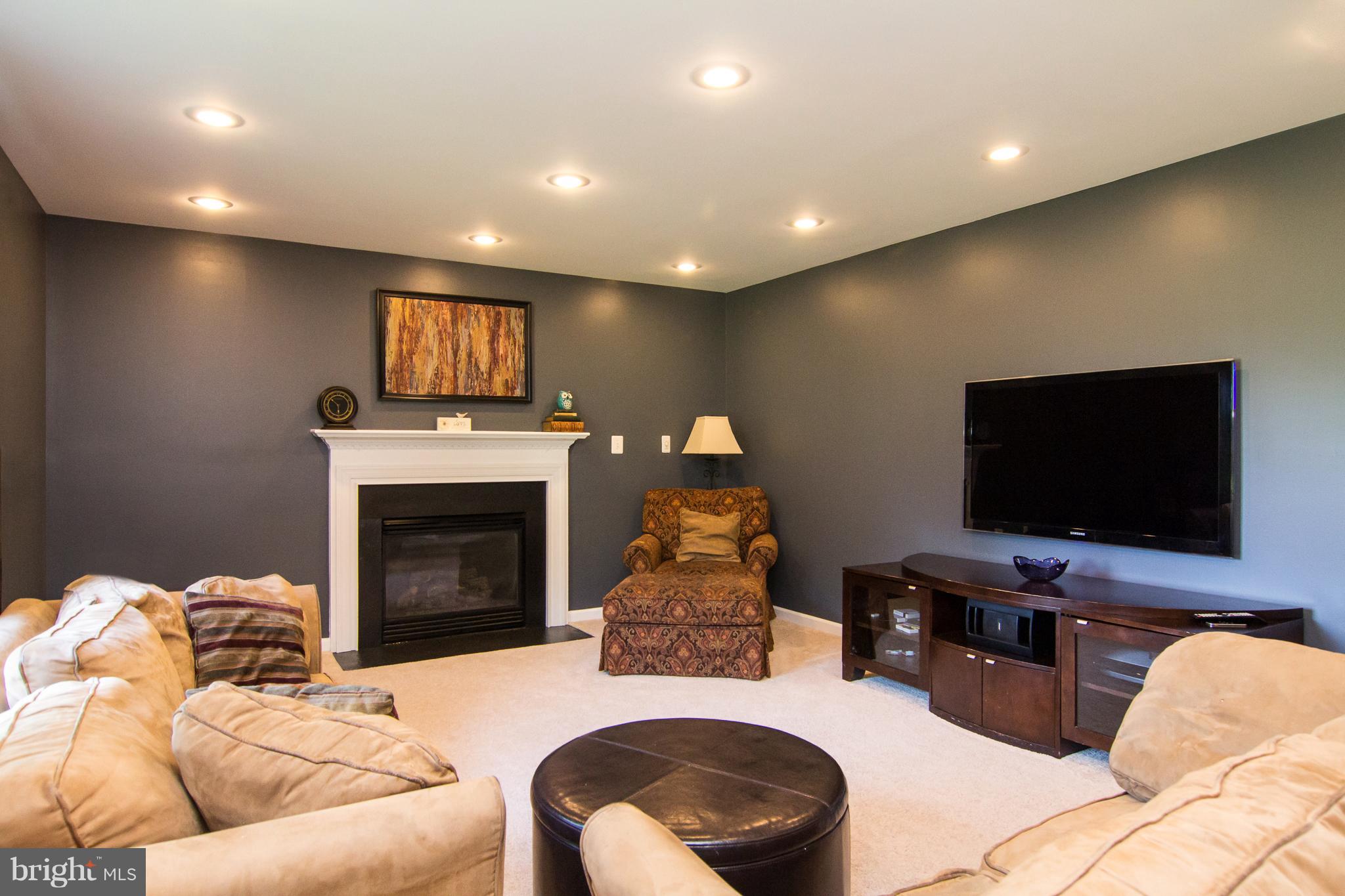 107 Trevanion Road Taneytown, MD 21787 - Photo 8 of 30 a living room with furniture and a flat screen tv