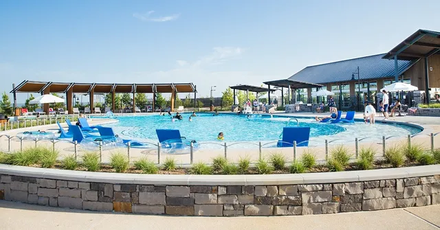 a bathroom with double sink and a mirror