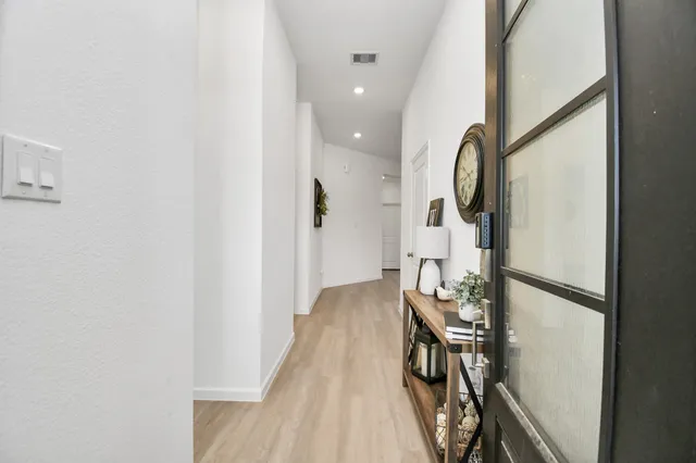 a kitchen with stainless steel appliances a refrigerator sink and cabinets