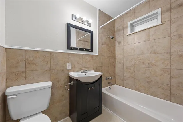 a bathroom with a toilet sink and bathtub