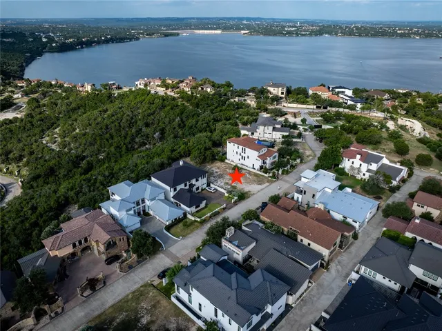 an aerial view of a house with a lake view
