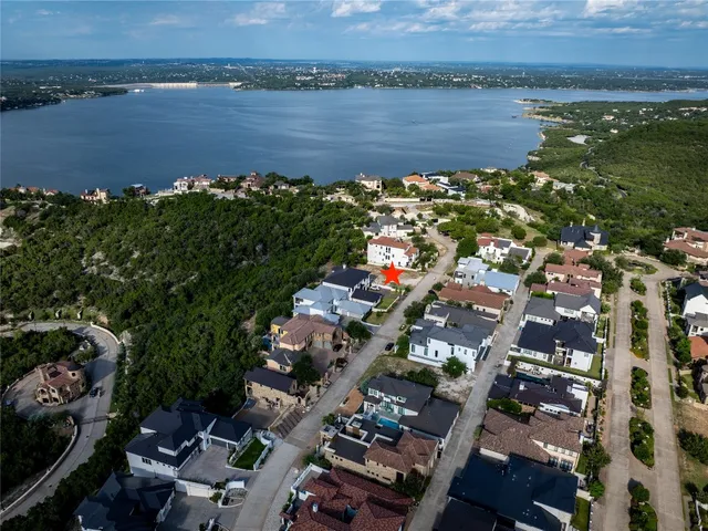 an aerial view of a city with lake view
