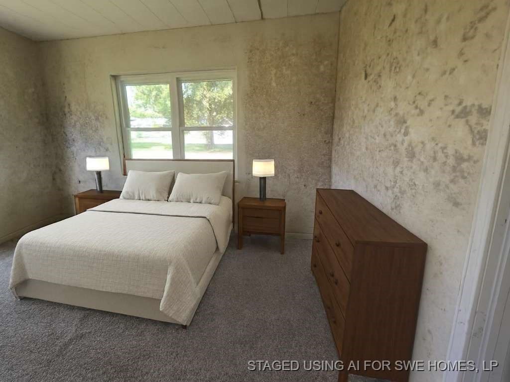 424 County Road 140 Liberty, TX 77575 - Photo 8 of 12 a bedroom with a bed and a window