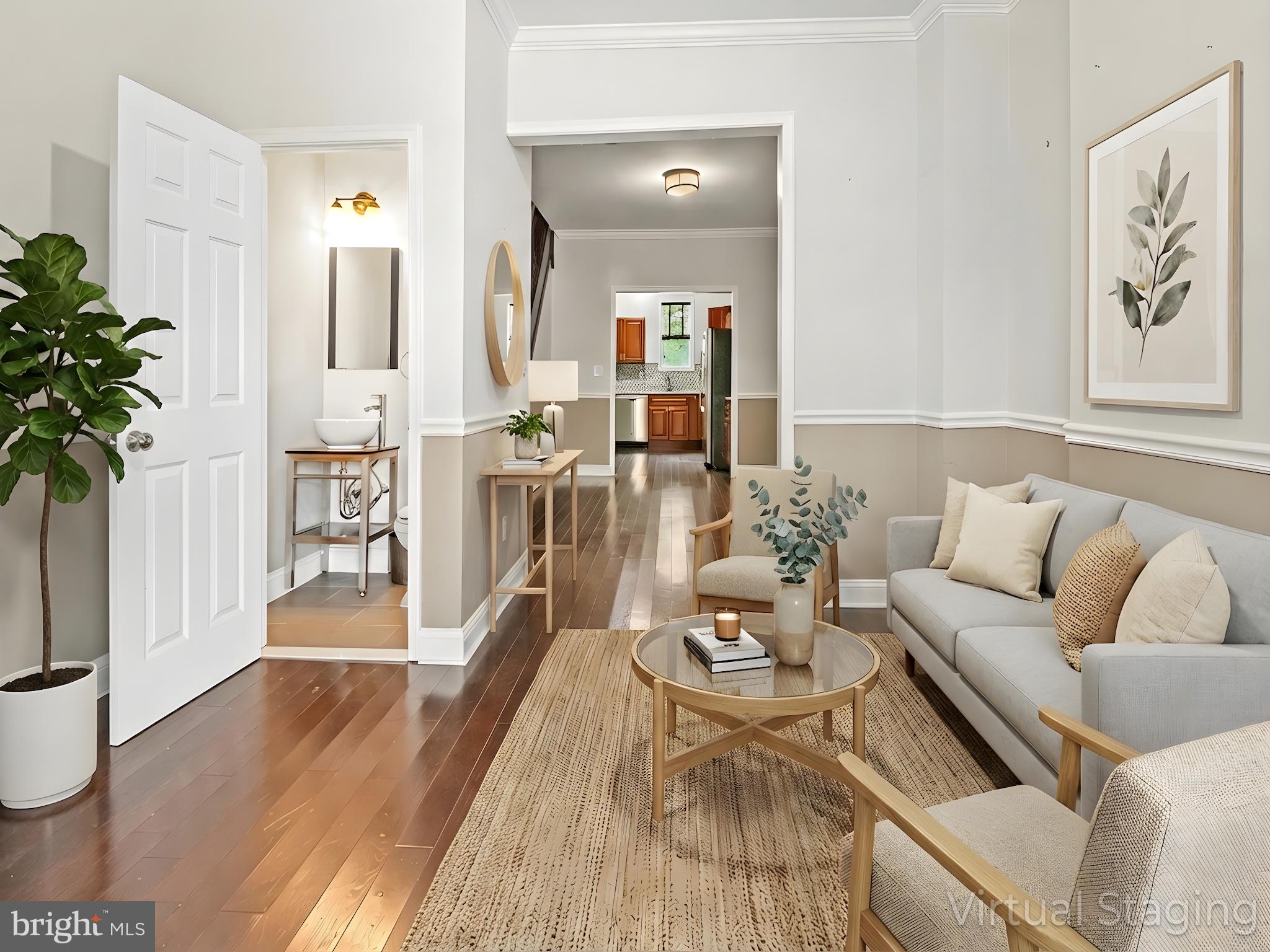 a living room with furniture and a potted plant