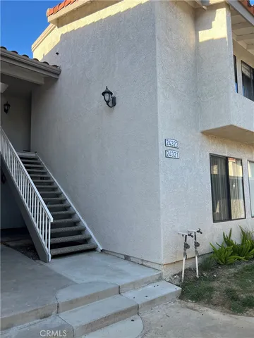 a kitchen with stainless steel appliances a stove top oven a refrigerator a sink and dishwasher