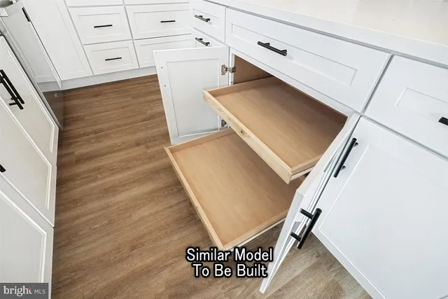 a spacious bathroom with a double vanity sink and mirror