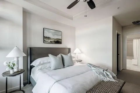 a bedroom with a bed and a lamp