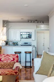a living room with a couch and a stove top oven
