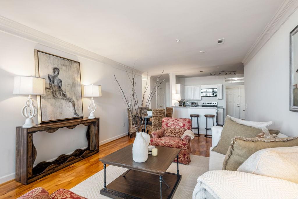 3334 Peachtree Road Northeast, Unit 1207 Atlanta, GA 30326 - Photo 5 of 25 a living room with furniture and a fireplace