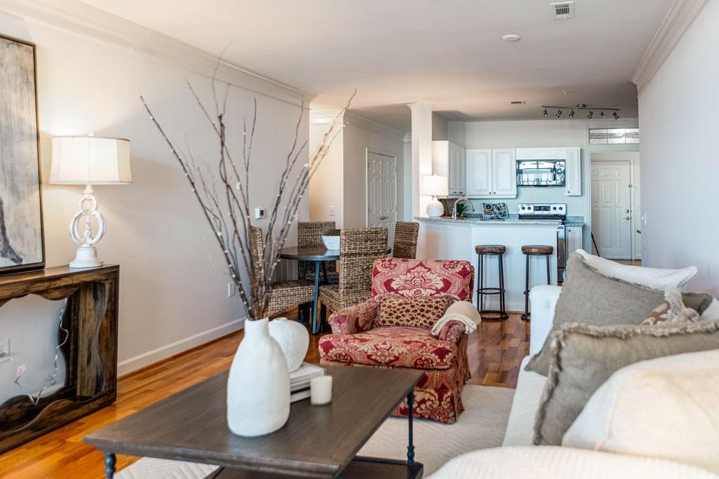 3334 Peachtree Road Northeast, Unit 1207 Atlanta, GA 30326 - Photo 8 of 25 a living room with furniture and a fireplace