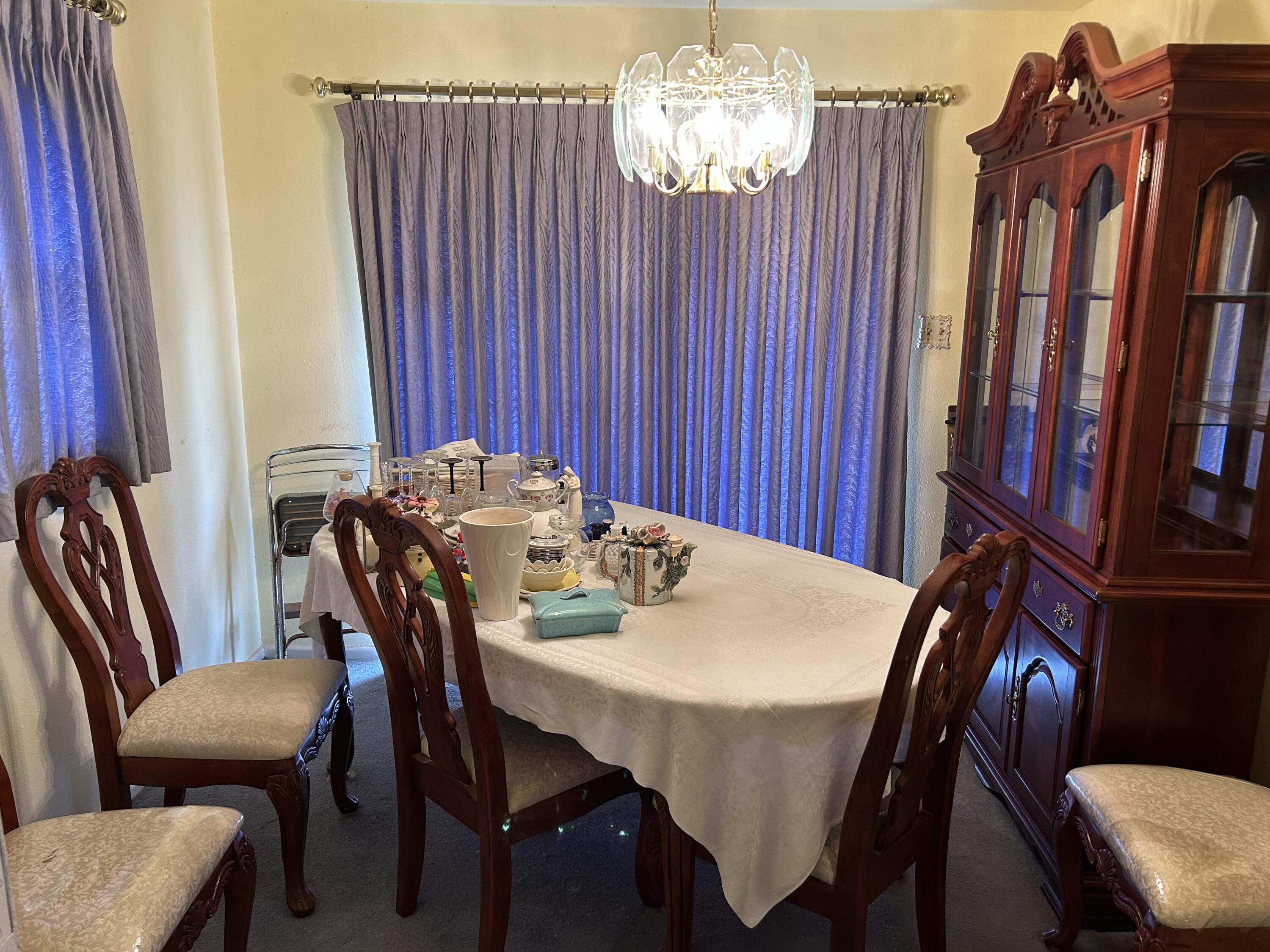 2802 Walnut Avenue Lubbock, TX 79404 - Photo 4 of 13 a view of a dining room with furniture and chandelier