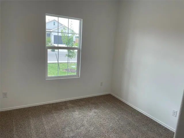 a white toilet sitting next to a bath tub