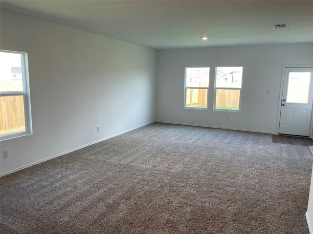 a kitchen with stainless steel appliances a sink and a refrigerator