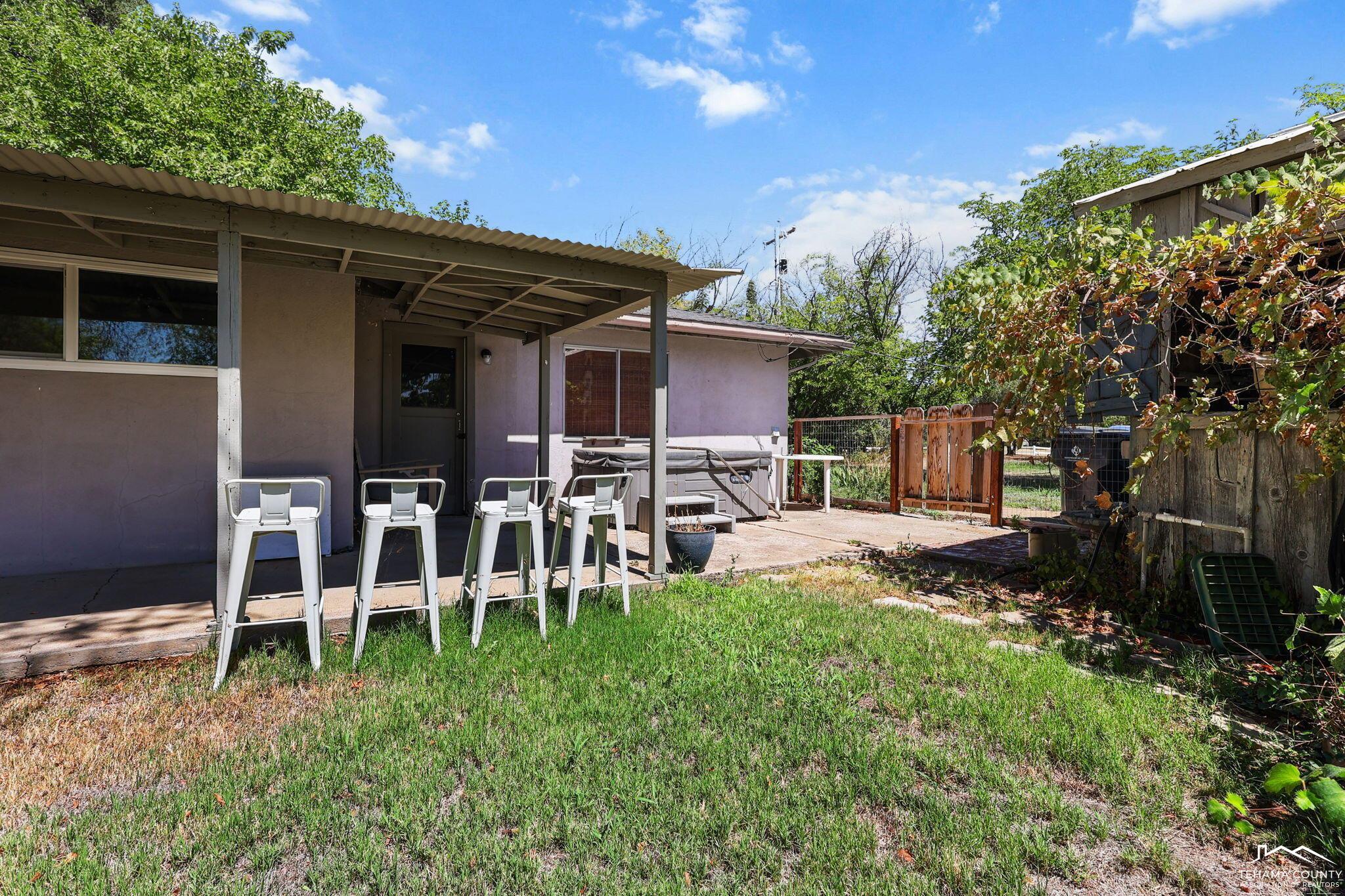 22275 Brent Road Red Bluff, CA 96080 - Photo 25 of 47 a view of a chair and table in backyard of the house