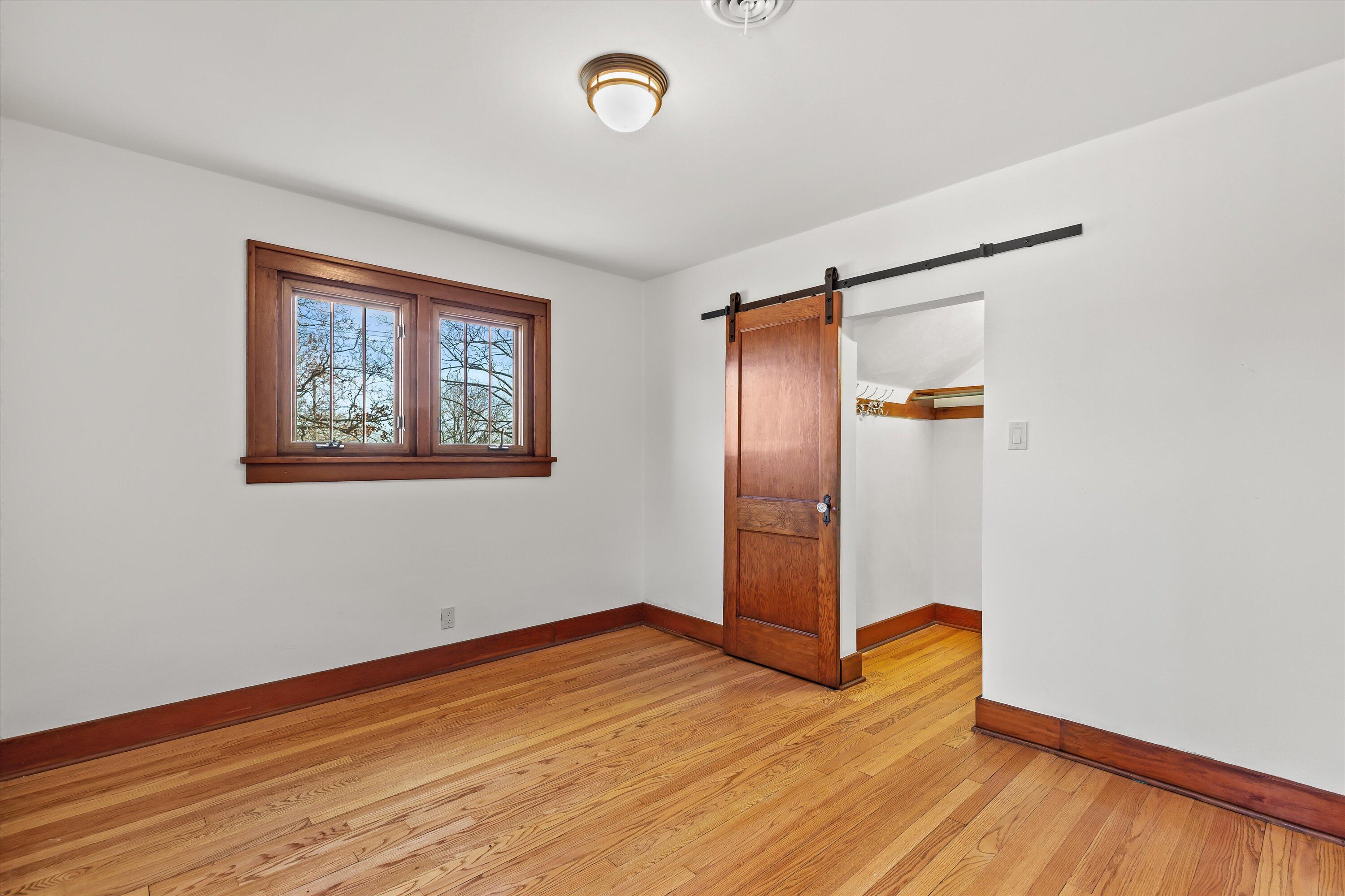 N7243 North Crystal Lake Road Beaver Dam, WI 53916 - Photo 22 of 46 Bedroom 2 w/Barn Door
