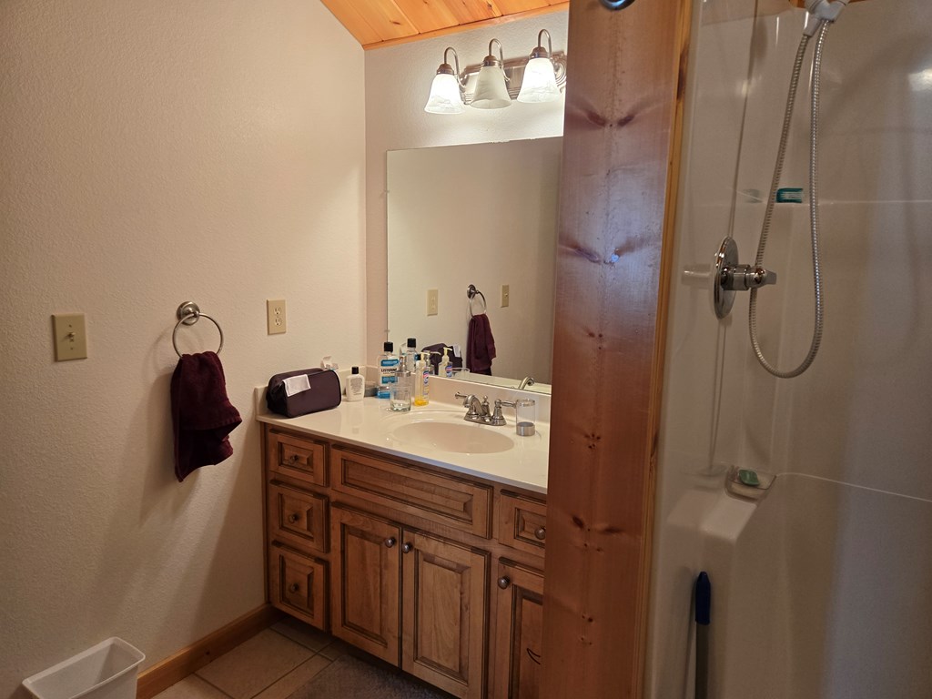 586 Laurel Haven Road Hayesville, NC 28904 - Photo 13 of 34 a bathroom with a sink and mirror