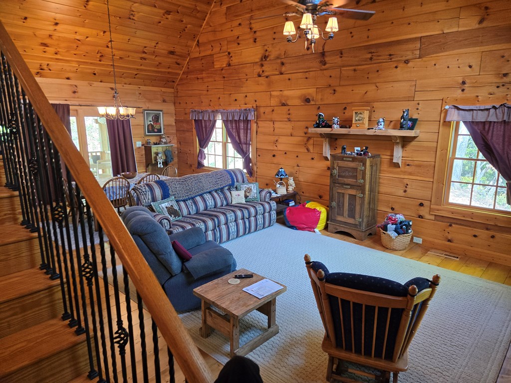 586 Laurel Haven Road Hayesville, NC 28904 - Photo 22 of 34 a outdoor living space with furniture and a wooden floor