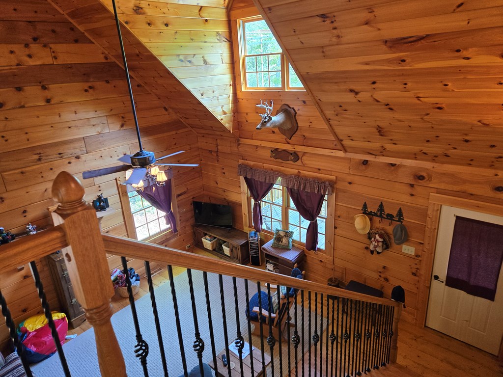 586 Laurel Haven Road Hayesville, NC 28904 - Photo 24 of 34 a view of stairs and a hall with wooden floor
