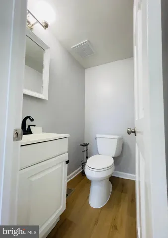 a bathroom with a toilet and a sink