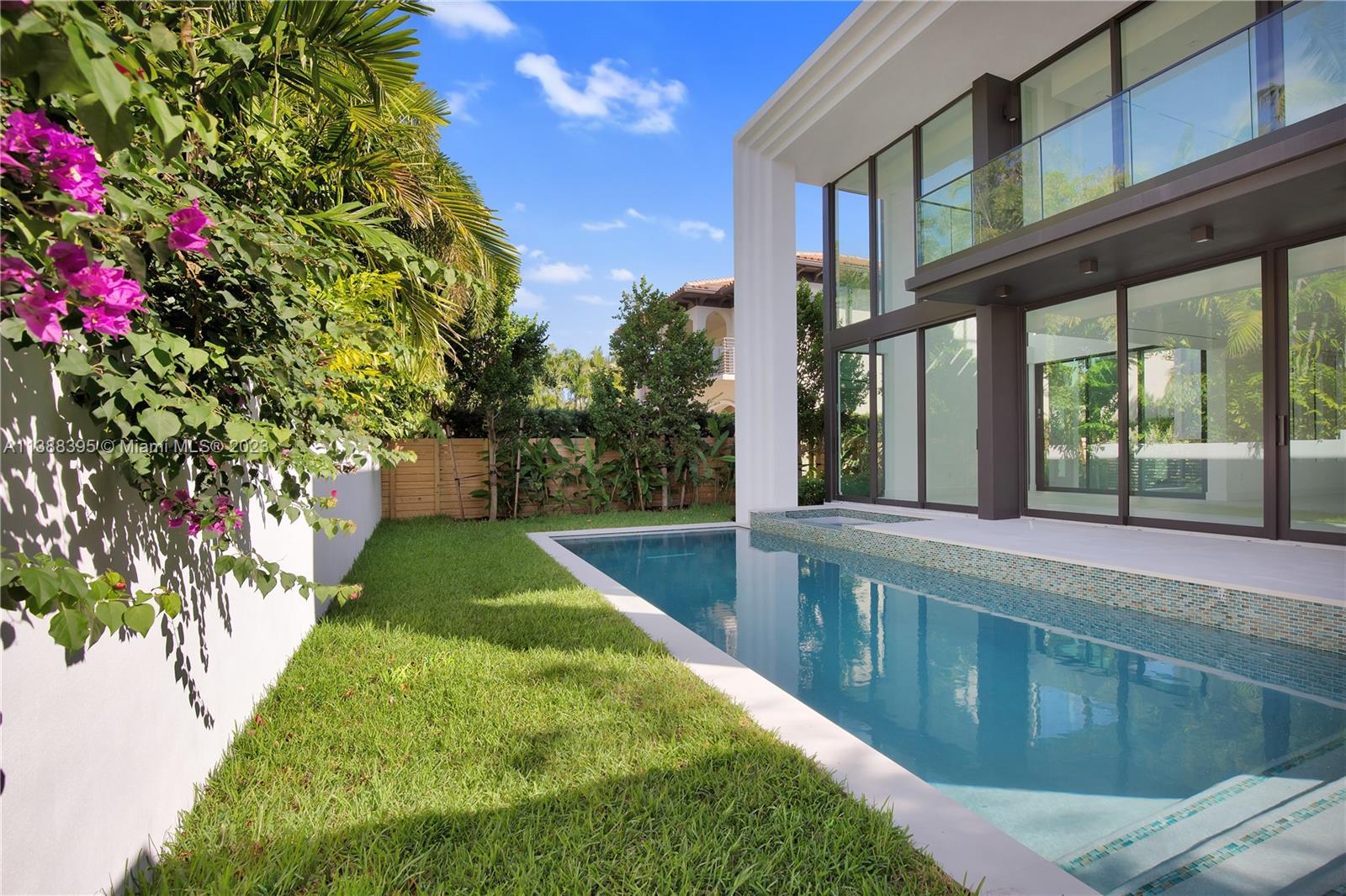 5630 Pine Tree Drive Miami Beach, FL 33140 - Photo 4 of 32 a swimming pool with yard and outdoor seating