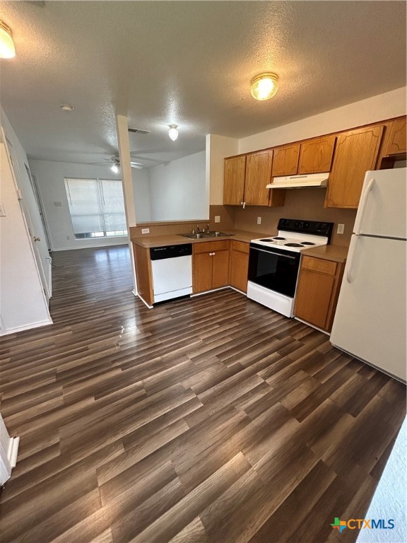 3805 Woodrow Drive, Unit C Killeen, TX 76549 - Photo 3 of 8 a kitchen with stainless steel appliances wooden floor and a counter top space