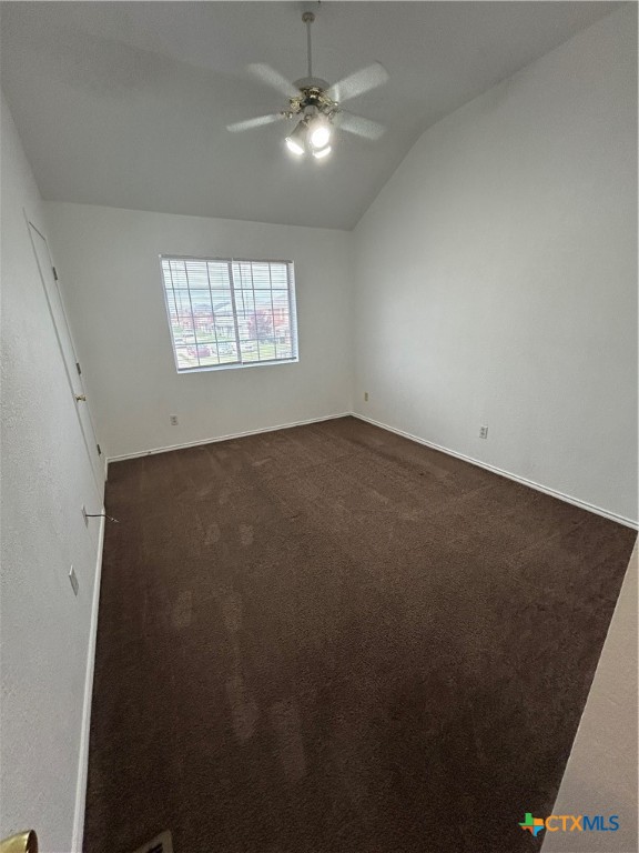 3805 Woodrow Drive, Unit C Killeen, TX 76549 - Photo 5 of 8 an empty room with windows and fan