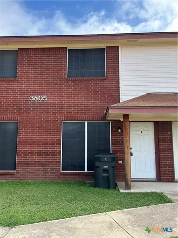 a brick house with a yard