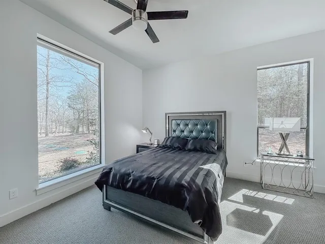 a bedroom with a bed and window