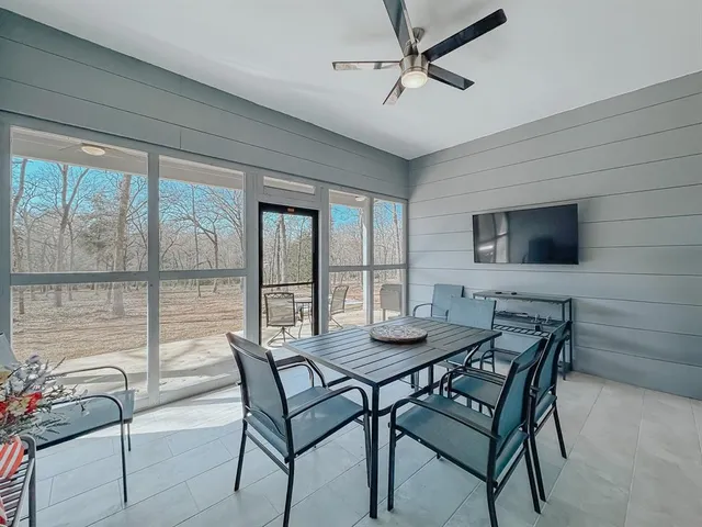 a dining room with furniture and window
