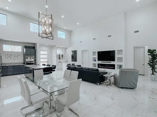 a view of a livingroom with furniture and a flat screen tv
