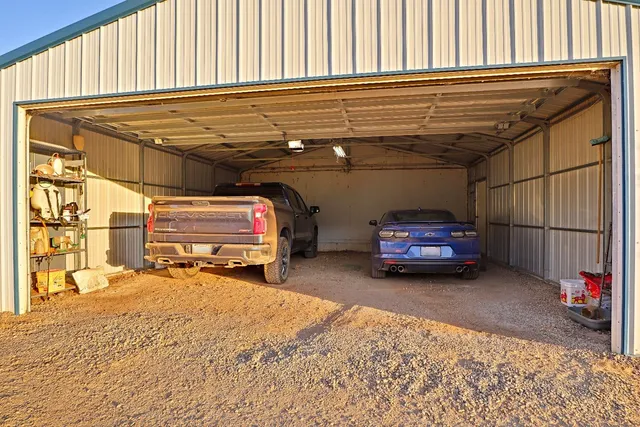 a living room with furniture gym equipment and a flat screen tv