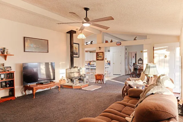 a kitchen with a sink a stove and a refrigerator