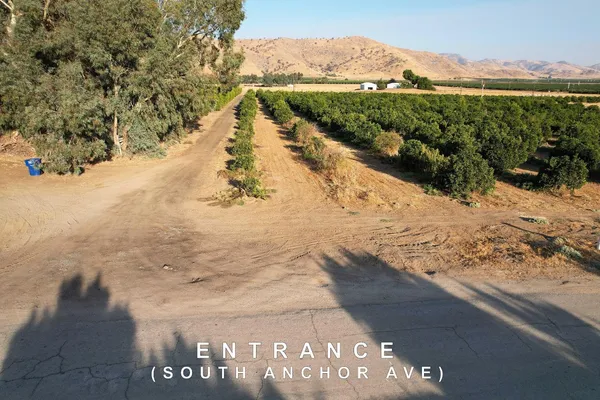 an aerial view of a house with a lake view