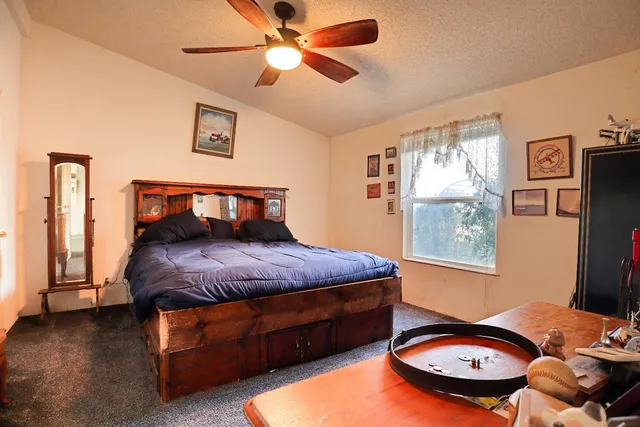 a view of a lake with a yard and mountain