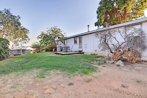 a view of a lake with a house in the background