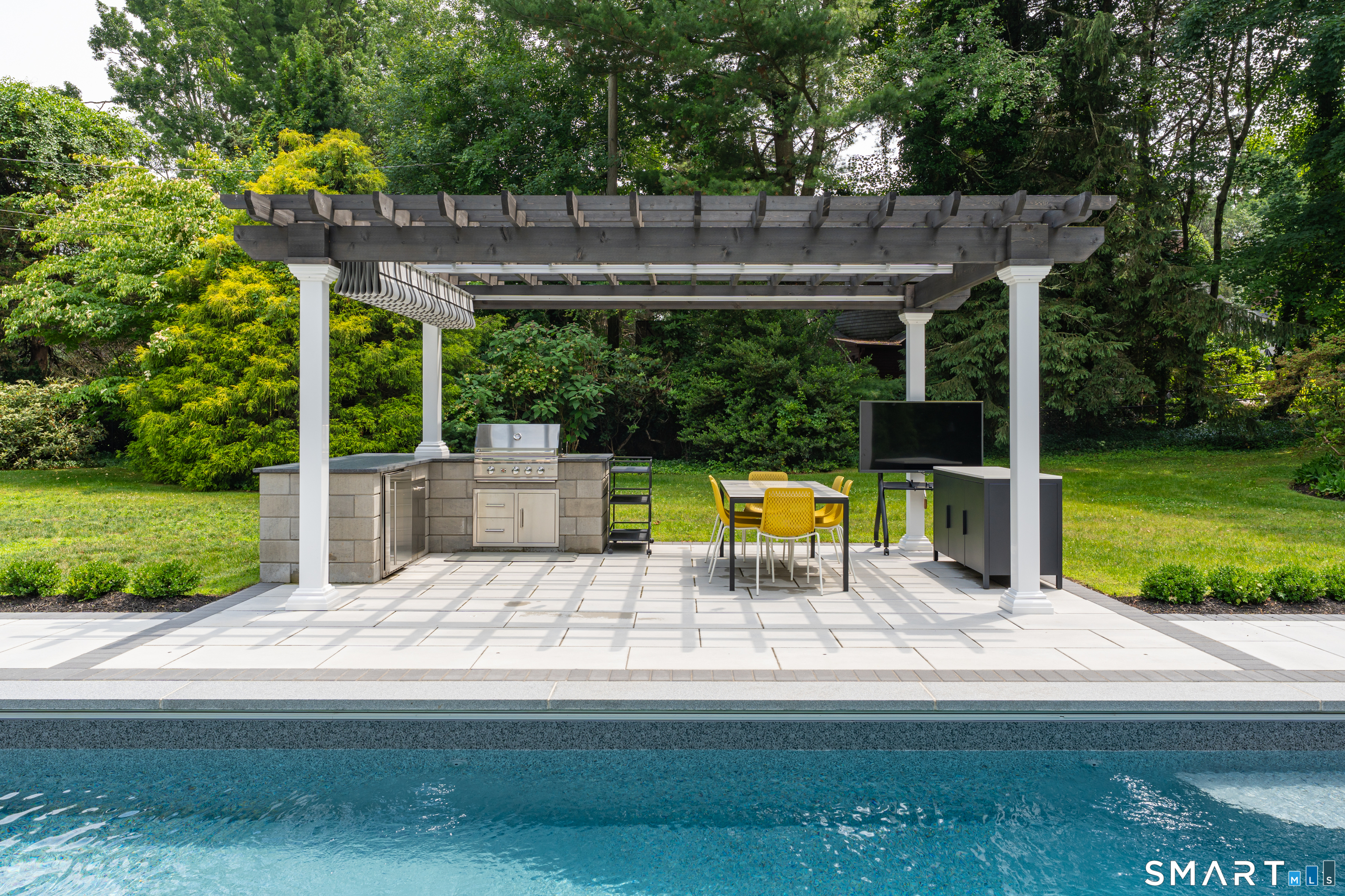 33 River Edge Farms Road Madison, CT 06443 - Photo 37 of 40 The Atlas Outdoor Living pergola and built-in Summerset grill create the ultimate outdoor destination for dining, entertaining, and relaxing.
