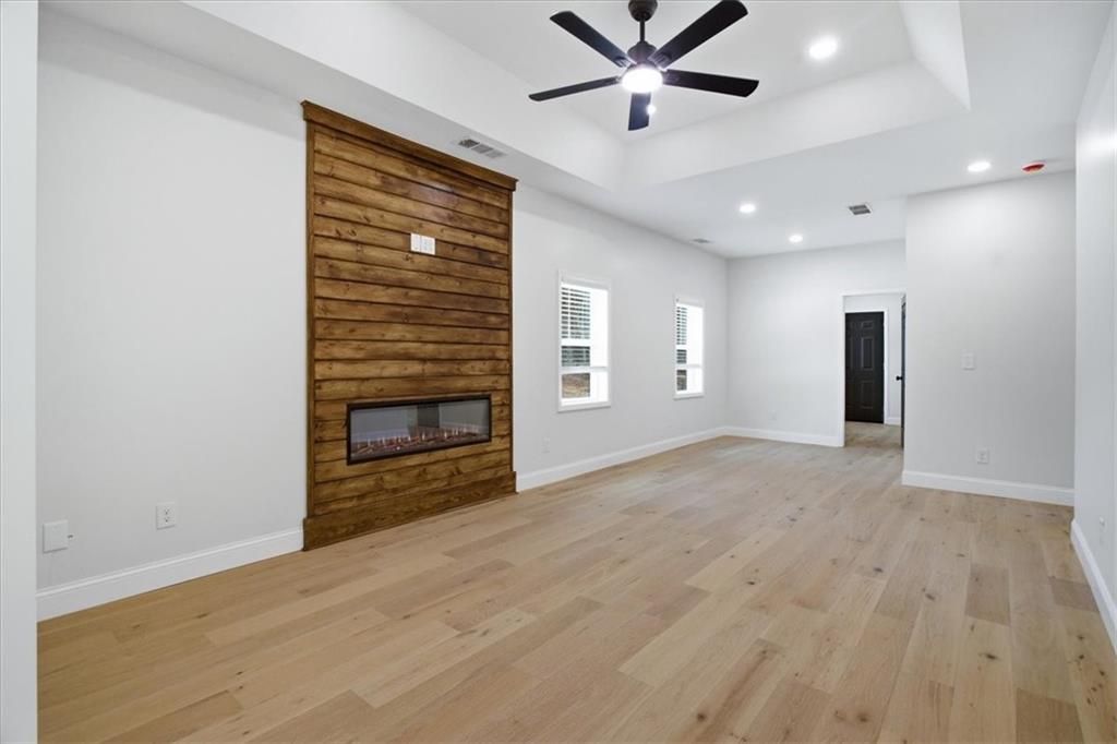 4911 Lower Jersey Road Oxford, GA 30054 - Photo 6 of 56 a view of an empty room with a window and fireplace