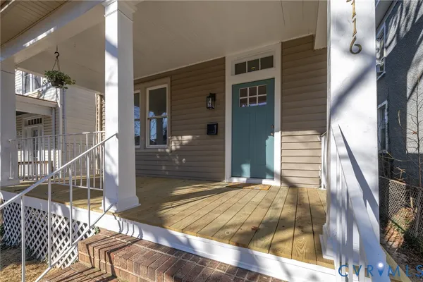a view of entryway with wooden floor