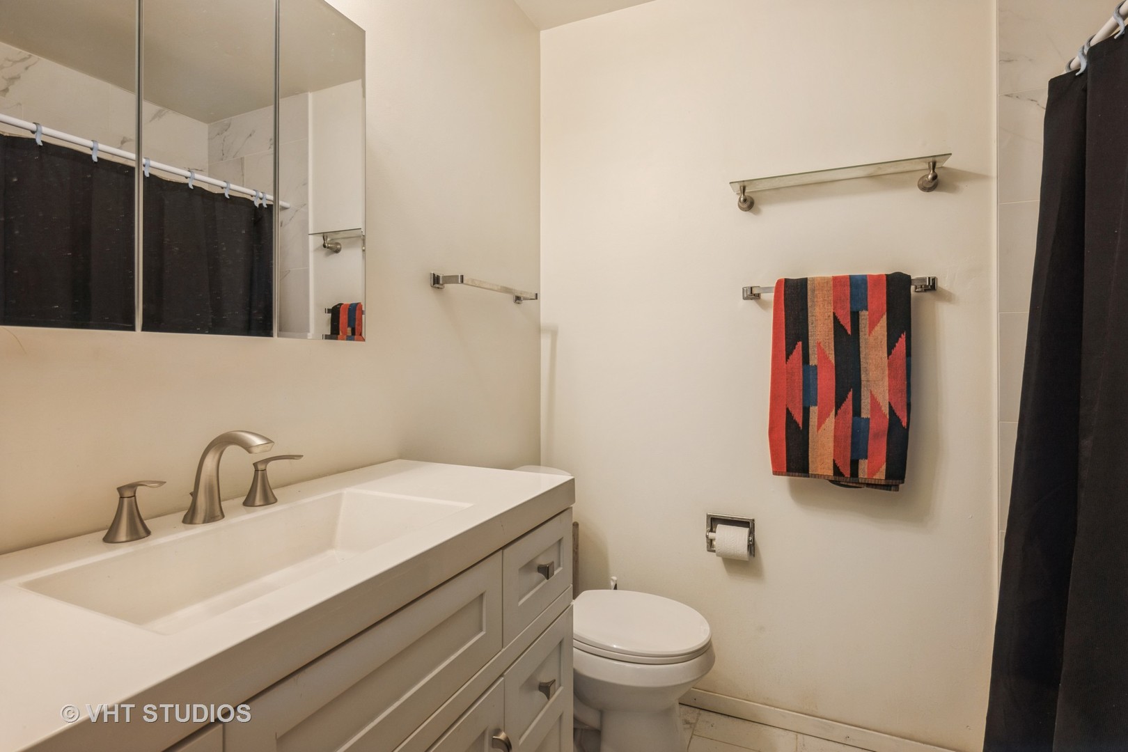 214 North School Street Cary, IL 60013 - Photo 7 of 11 a bathroom with a sink and a mirror