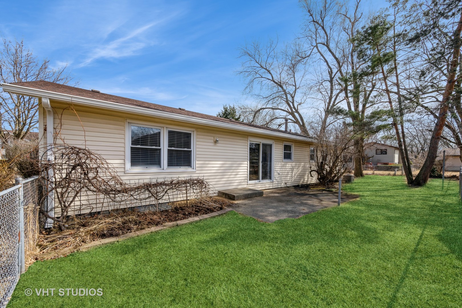 214 North School Street Cary, IL 60013 - Photo 9 of 11 a view of a house with a yard and a garden