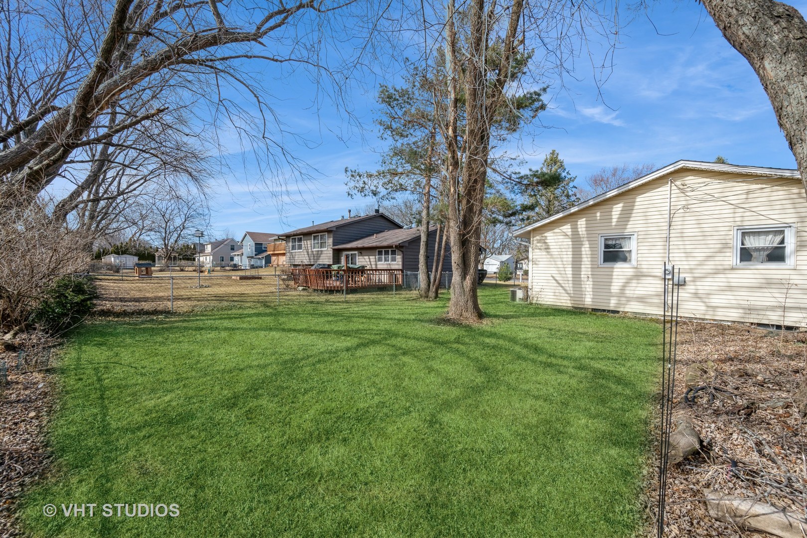 214 North School Street Cary, IL 60013 - Photo 11 of 11 a view of a house with backyard and trees