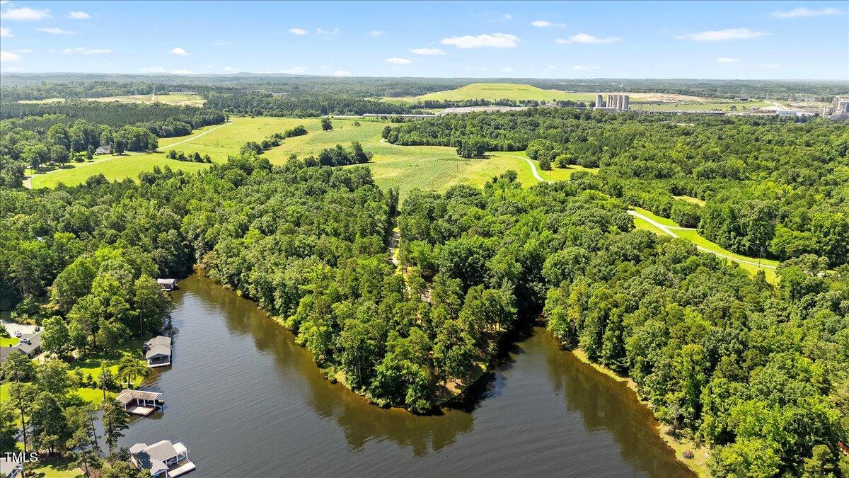424 Roy Carver Road Semora, NC 27343 - Photo 12 of 68 a view of a lake with a mountain view