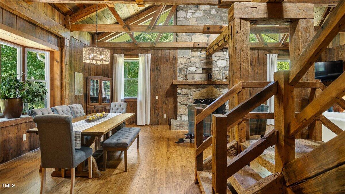 424 Roy Carver Road Semora, NC 27343 - Photo 13 of 68 a dining room with wooden floor and furniture
