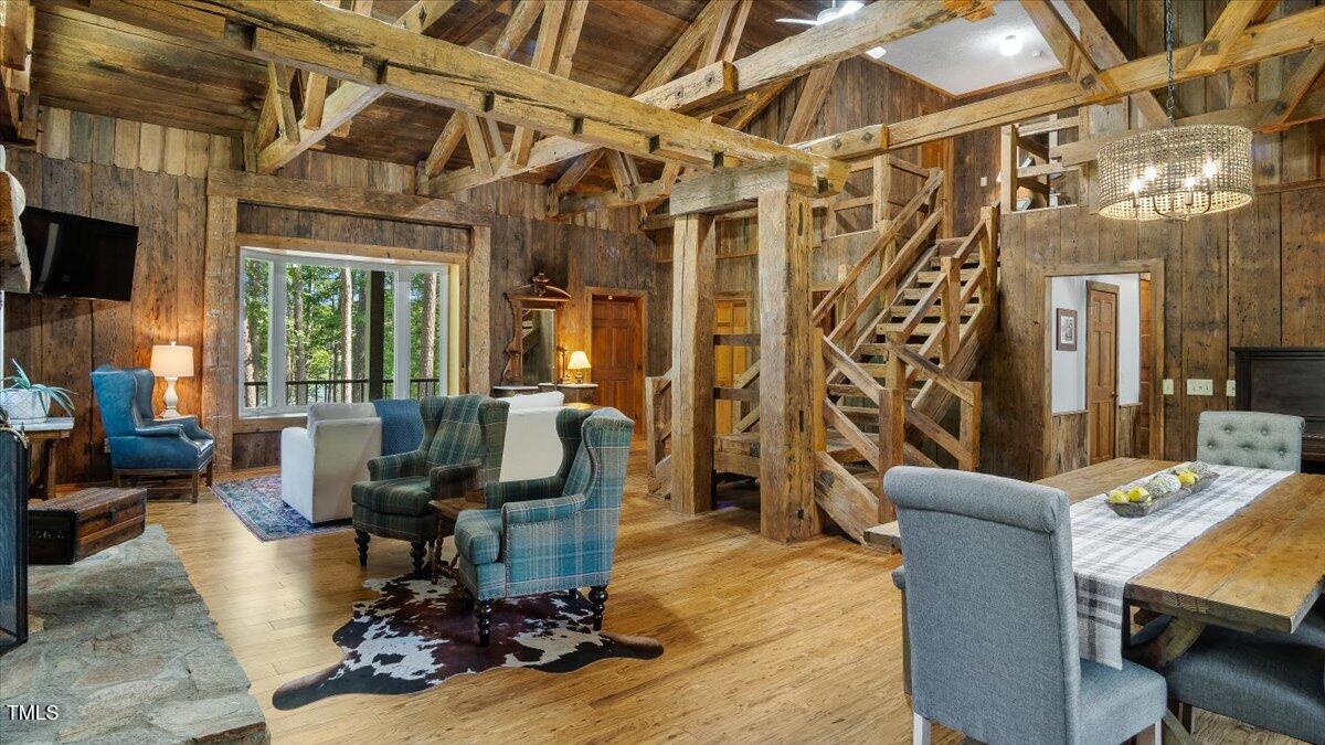 424 Roy Carver Road Semora, NC 27343 - Photo 16 of 68 a living room with furniture or chandelier and a wooden floor