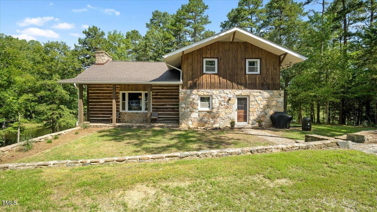 424 Roy Carver Road Semora, NC 27343 - Photo 2 of 68 a view of a house with a yard and large tree